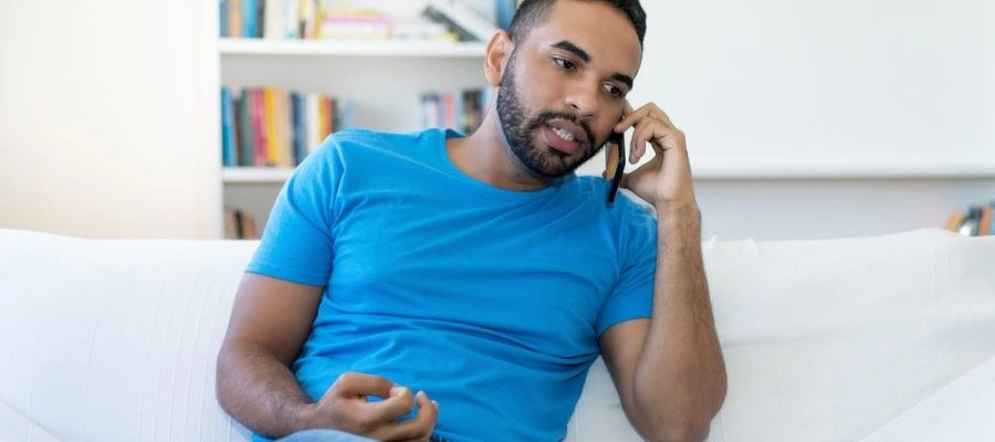 Man sitting with a phone in his ear - Call Icarus Wellness for a Foundation in Recovery Local to Boise