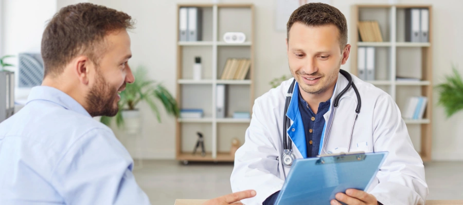 Patient and physician contently speaking with each other - MAT Treatment for Alcohol Use