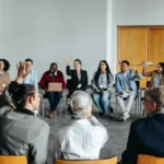 People sitting gathered in a room at an NA meeting - Top NA Meetings, Boise Idaho