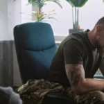 Image of a military man in anguish in consultation with his physician - Does TRICARE Cover Mental Health - Icarus Wellness and Recovery