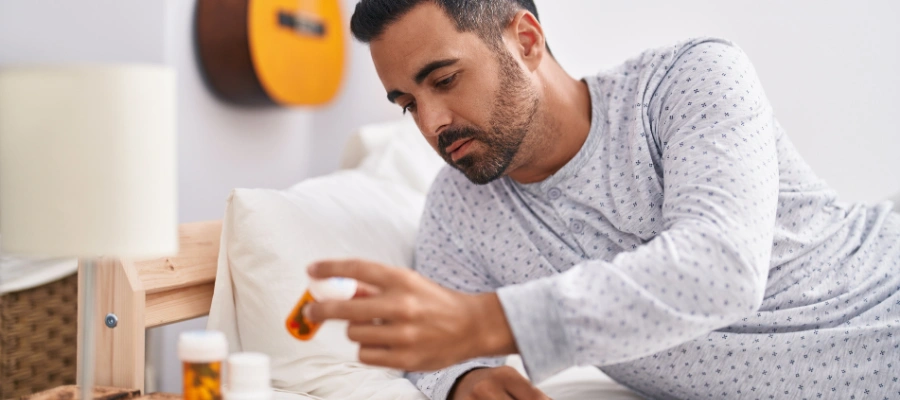 Image of a man checking his antidepressant medications  