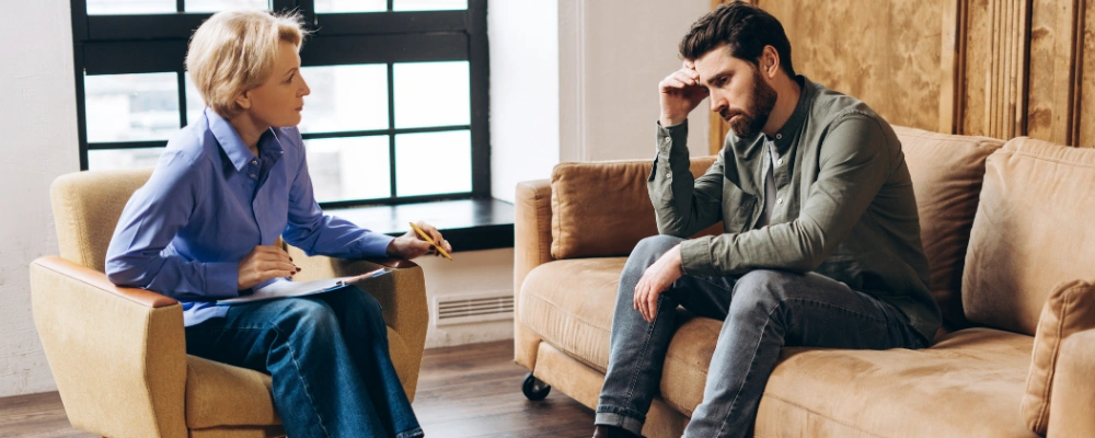 Image of man in one-on-one therapy session during inpatient rehab