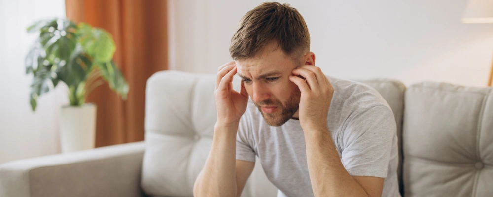 Image of of a man experiencing mood swings and sadness, representing major depressive disorder