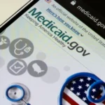 Image of a smart phone with medicaid.gov appearing on the screen - Does Medicaid Cover Rehab in Idaho - Icarus Wellness and Recovery
