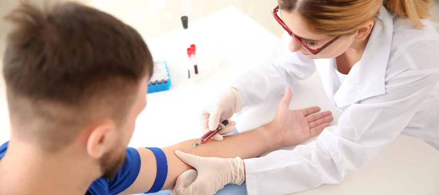 Image of a healthcare professional drawing a blood sample for alcohol testing