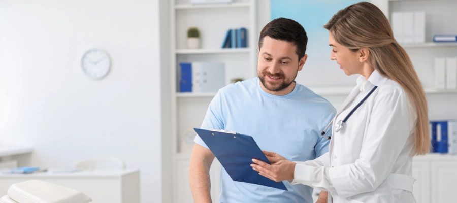 Image of healthcare provider explaining Medicaid coverage and treatment options to a patient