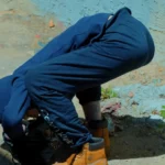 Image of a man bend over with Fentanyl Fold - What Is The Fentanyl Fold - Icarus Wellness and Recovery