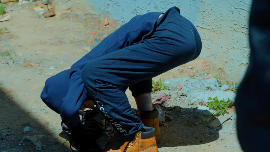 Image of a man bend over with Fentanyl Fold - What Is The Fentanyl Fold - Icarus Wellness and Recovery