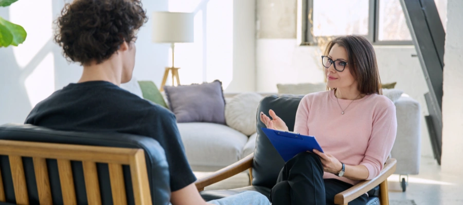 Image of a man in therapy with his counselor, reflecting on inner parts to support trauma healing and mental health growth