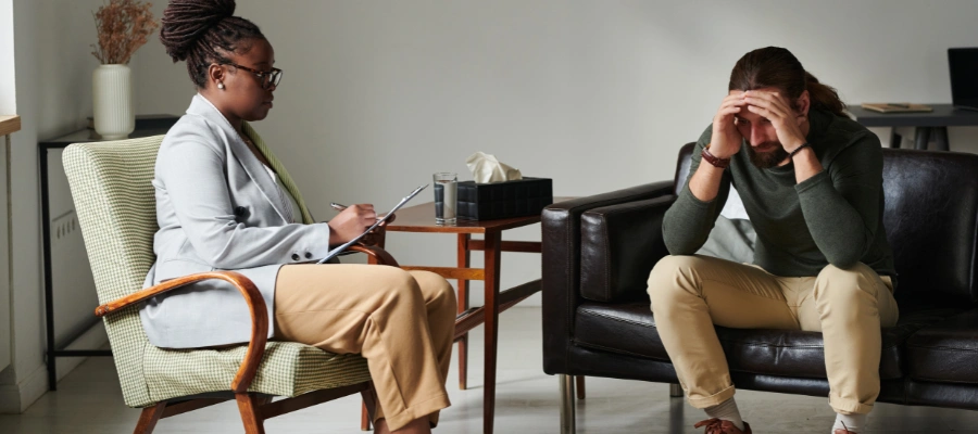 Image of a therapist guiding a client through REBT to treat his anxiety and depression