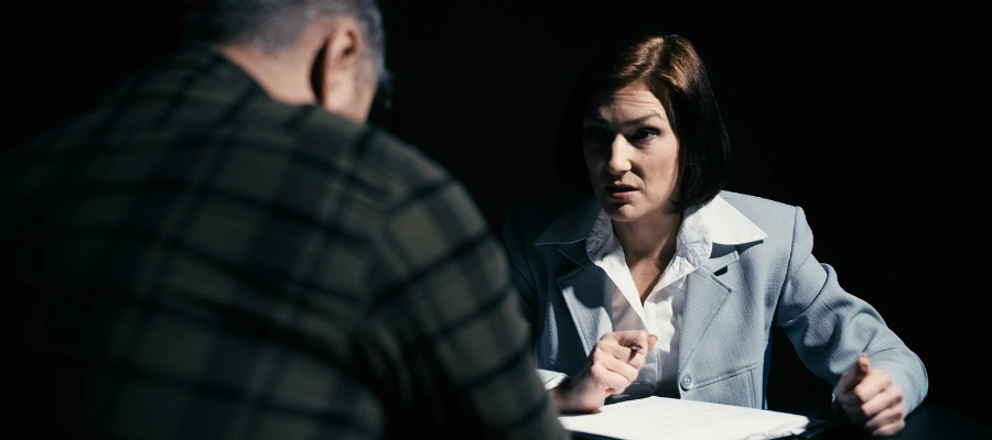 Image of a probation officer reviewing the failed drug test results to male probationer