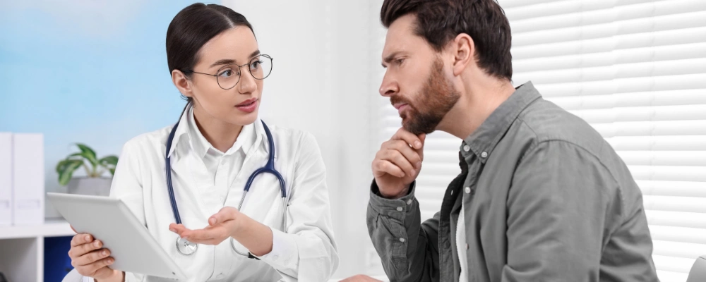 Image of a clinician speaking with a client about substance use and mental health treatment