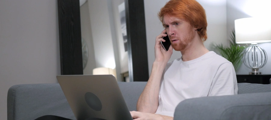 Image of a man making a confidential phone call to a trauma treatment center for CPTSD support and admissions information