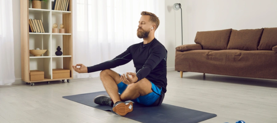 Image of a person practicing meditation and self care to support their own mental health