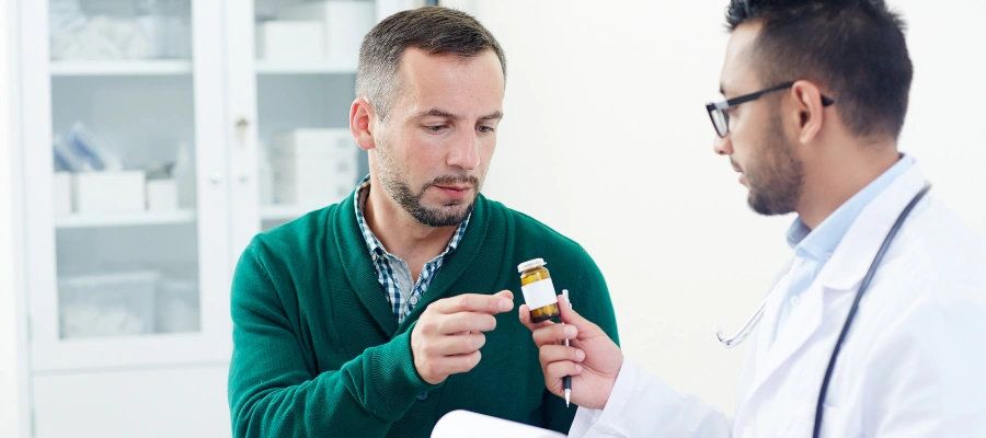 Doctor giving prescribed medication to patient as part of treating bipolar disorder