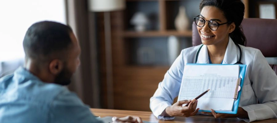 Image of a person reviewing St. Luke's Health Plan coverage options for addiction treatment programs