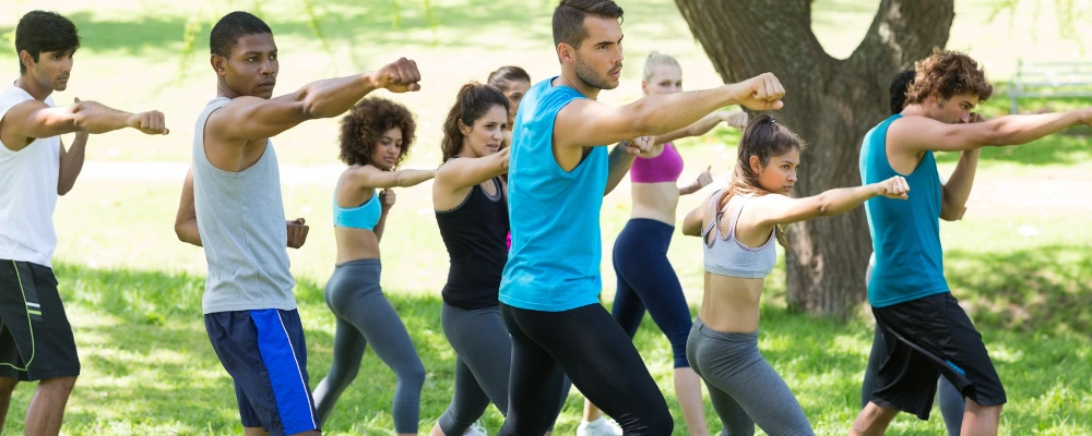 Image of a group of people participating in an outdoor fitness activity as part of a substance abuse recovery and relapse prevention program