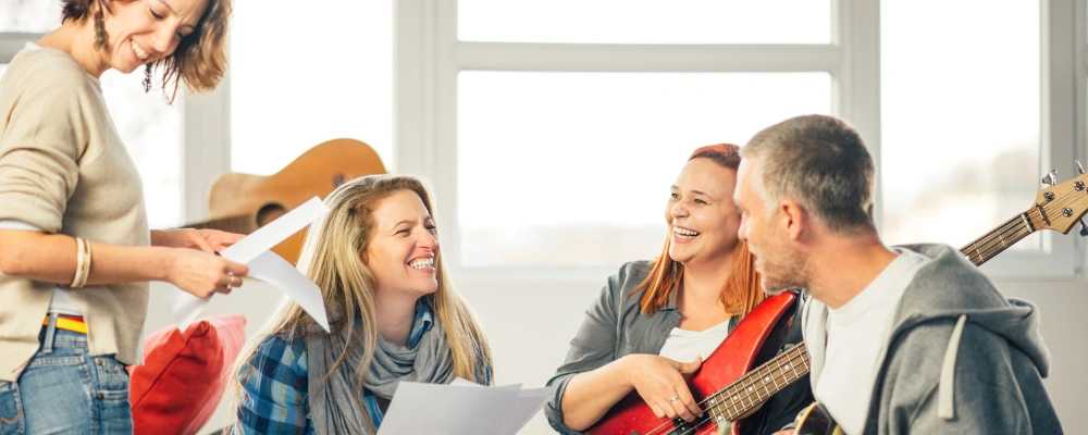Image of a group engaged in music-making and improvisation as part of a therapeutic recovery session