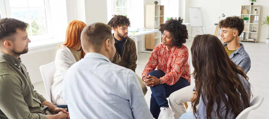 Image of a group therapy session with men receiving structured mental health treatment and support at Icarus Behavioral Health