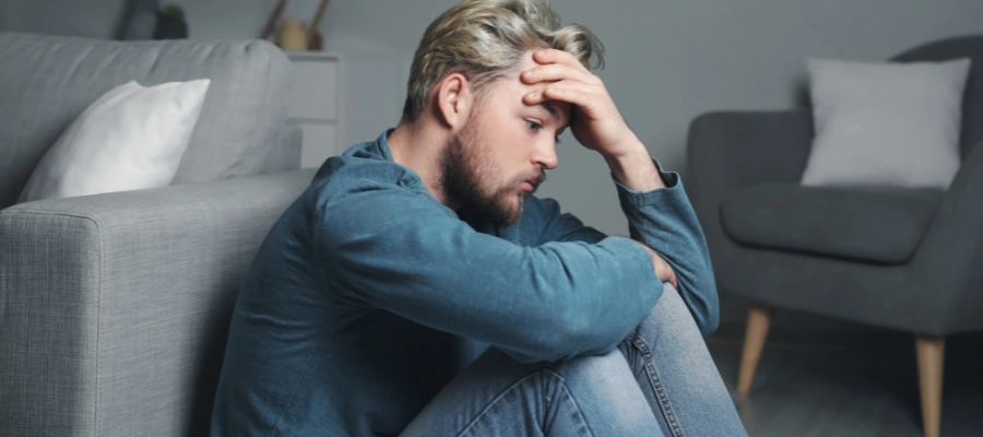 Image of a man at a crossroads making recovery choices between relapse and continuing sobriety