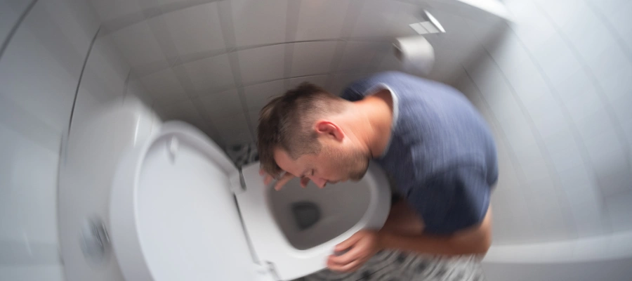 Image of a man experiencing dizziness and nausea as common symptoms during the Lexapro withdrawal timeline