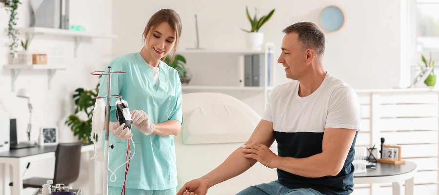 Image of a nurse monitoring vital signs and providing medical supervision during a medically supervised detoxification process