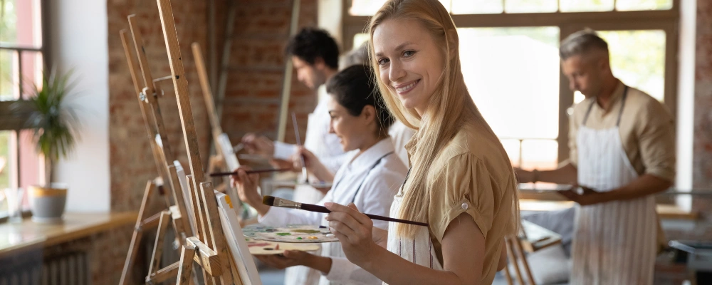 Image of participants engaging in guided creative activities during a group treatment session
