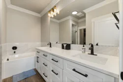 Double vanity bathroom with white cabinetry at Icarus Behavioral Health Idaho