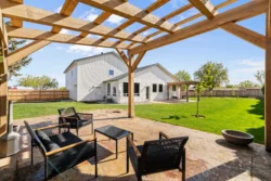 Outdoor patio with pergola and lounge seating at Icarus Idaho campus