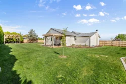 Side view of facility building with open green space